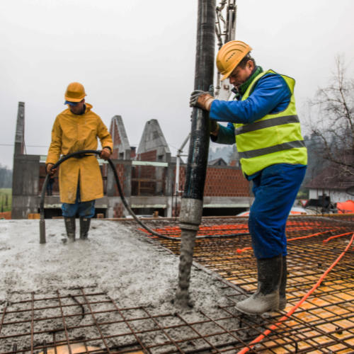 Construction Workers Concrete Line Pumping Construction Workers Concrete Line Pumping